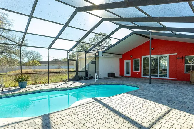 a swimming pool with outdoor view