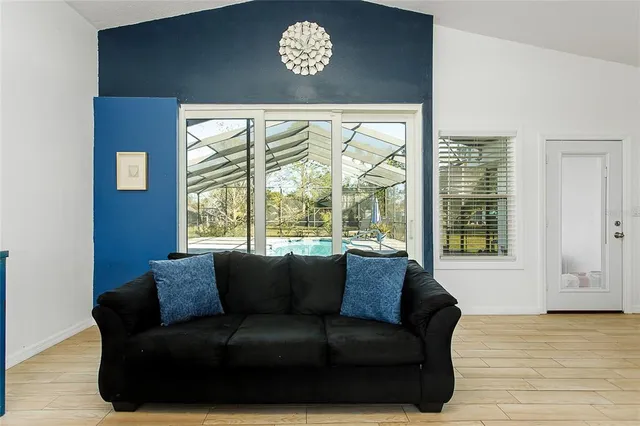 a living room with furniture and a window