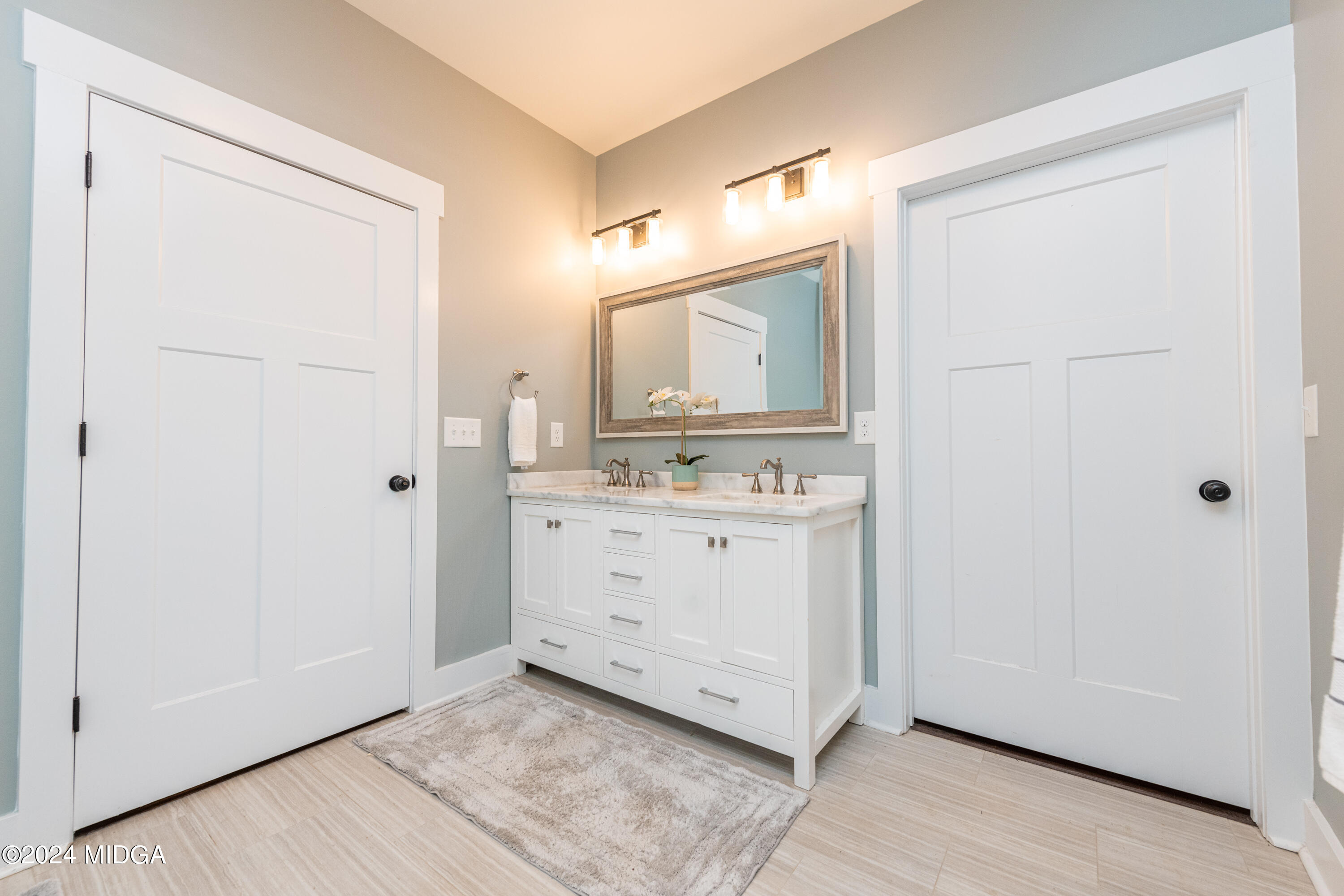 158 Harper Road Perry, GA 31069 - Photo 31 of 46 a bathroom with a sink a mirror and a vanity