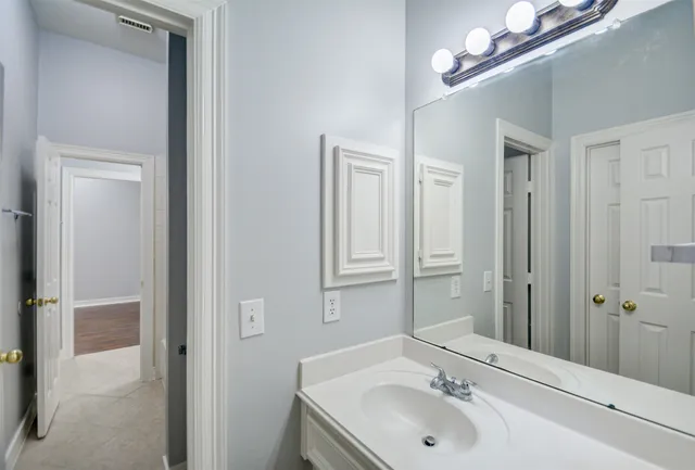 a bathroom with a sink and a mirror