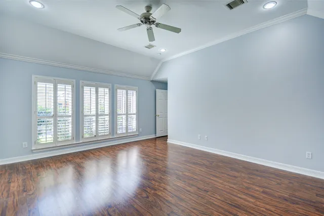 a bathroom with a tub a sink and a large mirror