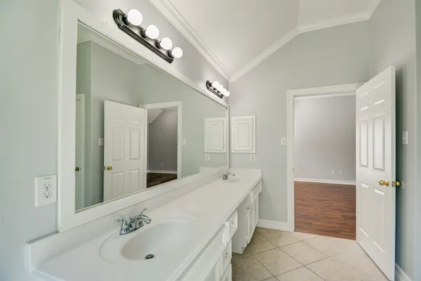 a view of a kitchen with a sink and a refrigerator
