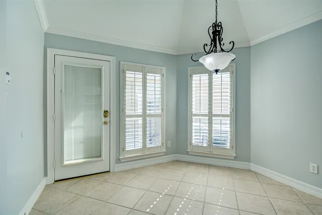 a kitchen with granite countertop a sink and cabinets