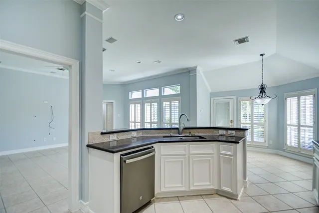a kitchen with white cabinets