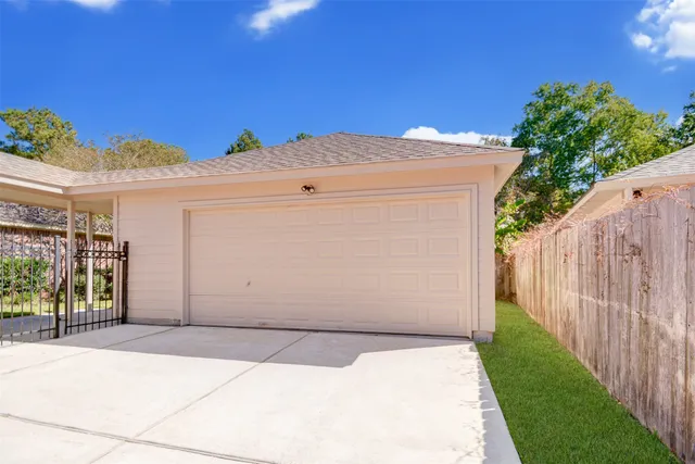 an aerial view of a house with a yard and outdoor seating