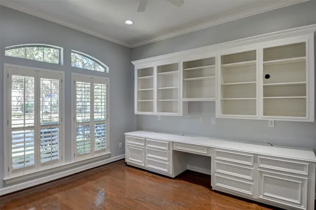 a living room with a bed furniture and a window