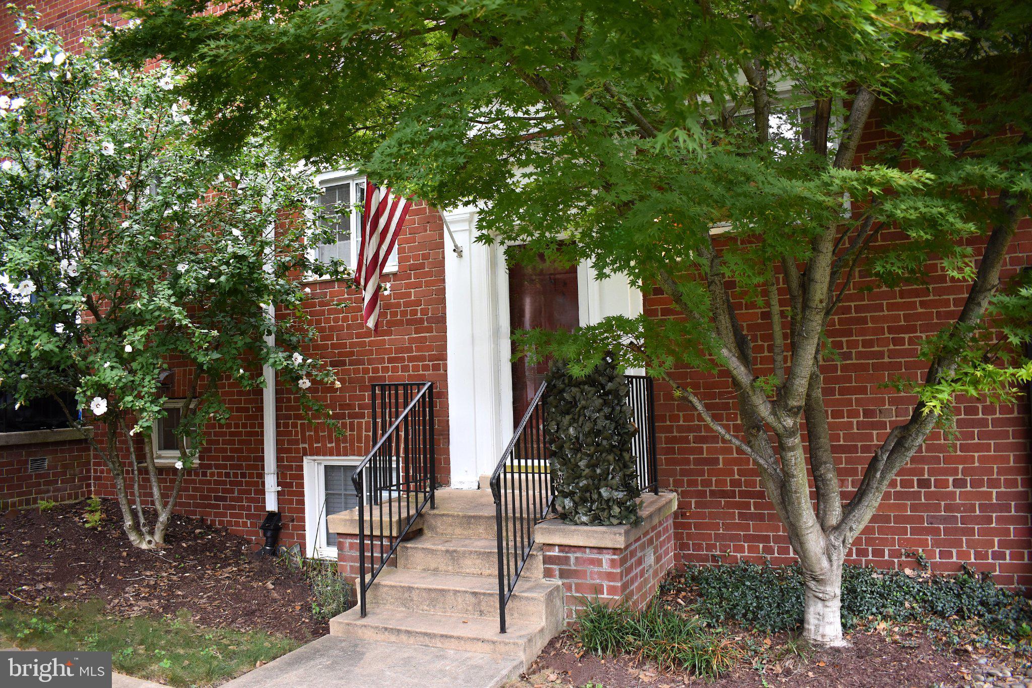 3706 Gunston Road Alexandria, VA 22302 - Photo 1 of 32 Charming entrance with lush greenery.