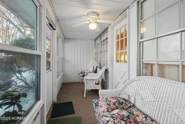 a bedroom with furniture and a window
