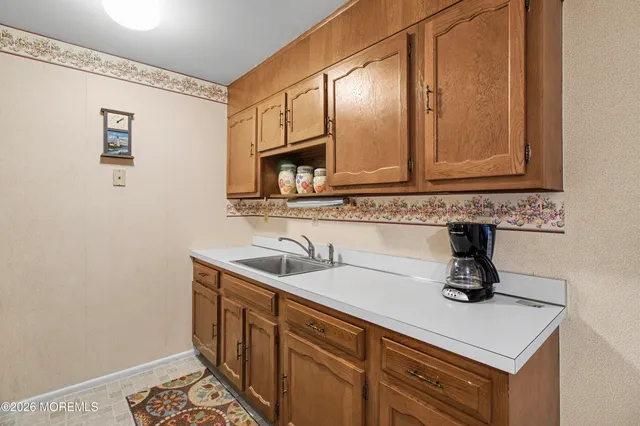 a bathroom with a sink a mirror and vanity