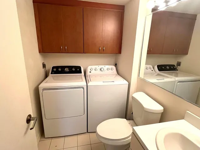 a en suite bathroom with a sink double vanity and a mirror