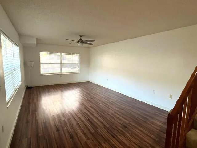 a kitchen with a wooden floor and a sink