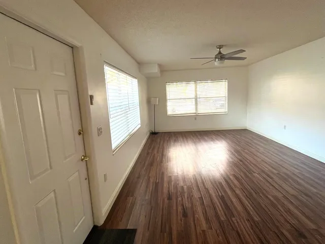 a view of entryway with wooden floor and stairs
