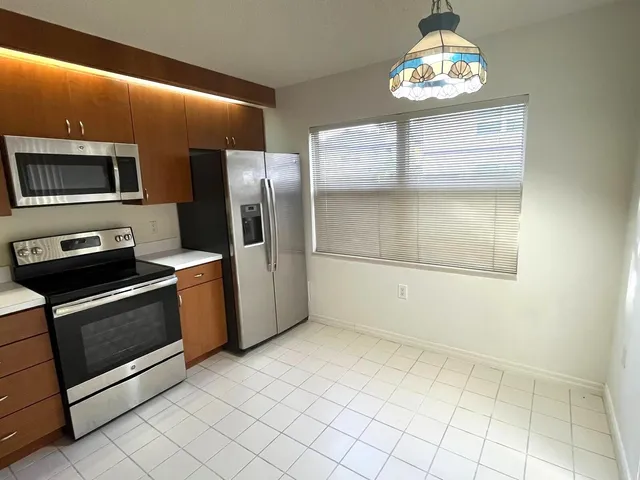 a bathroom with a sink toilet and mirror
