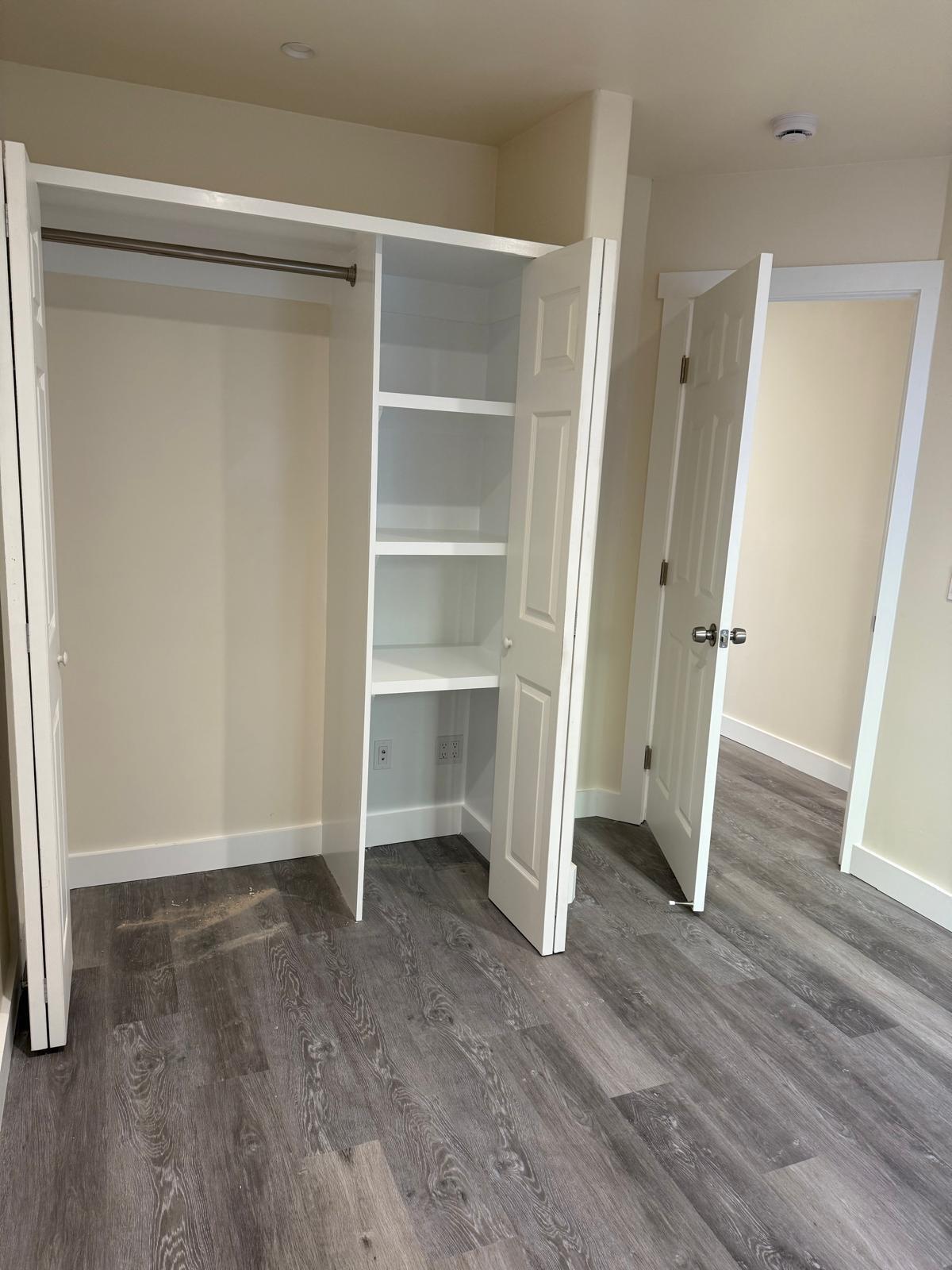 4946 8th Street, Unit B Carpinteria, CA 93013 - Photo 12 of 20 a view of an empty room with wooden floor and closet