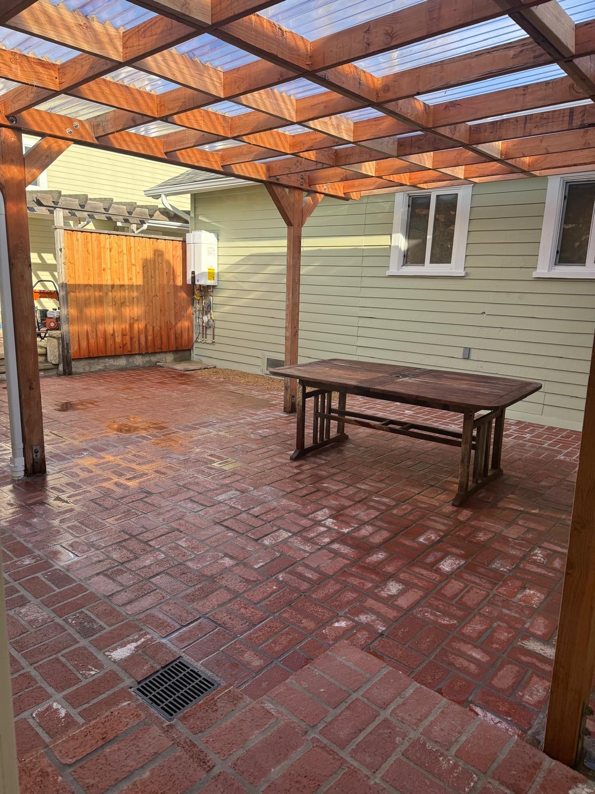 4946 8th Street, Unit B Carpinteria, CA 93013 - Photo 13 of 20 a backyard of a house with barbeque oven table and chairs