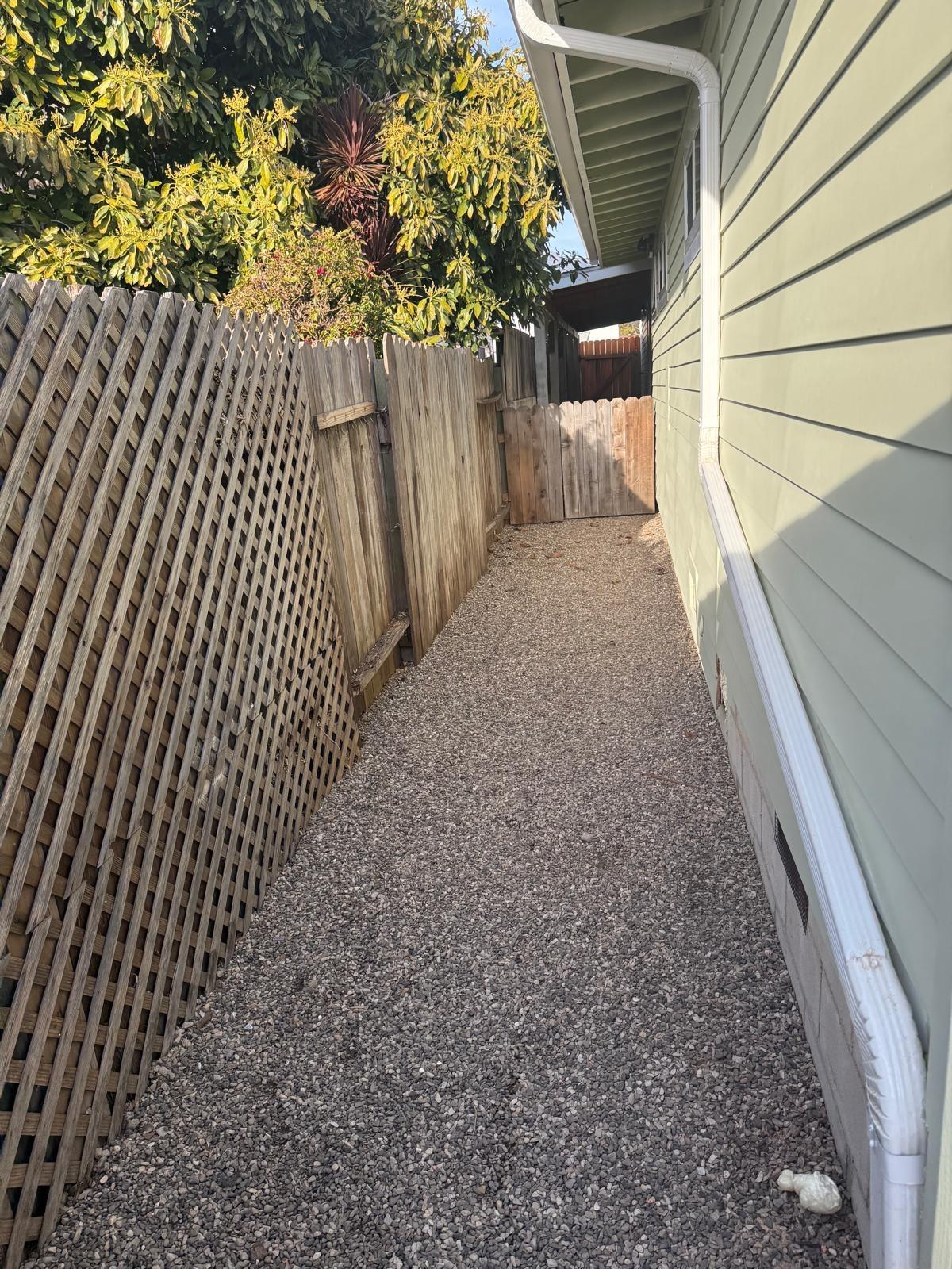 4946 8th Street, Unit B Carpinteria, CA 93013 - Photo 19 of 20 a view of a pathway of a house with wooden fence