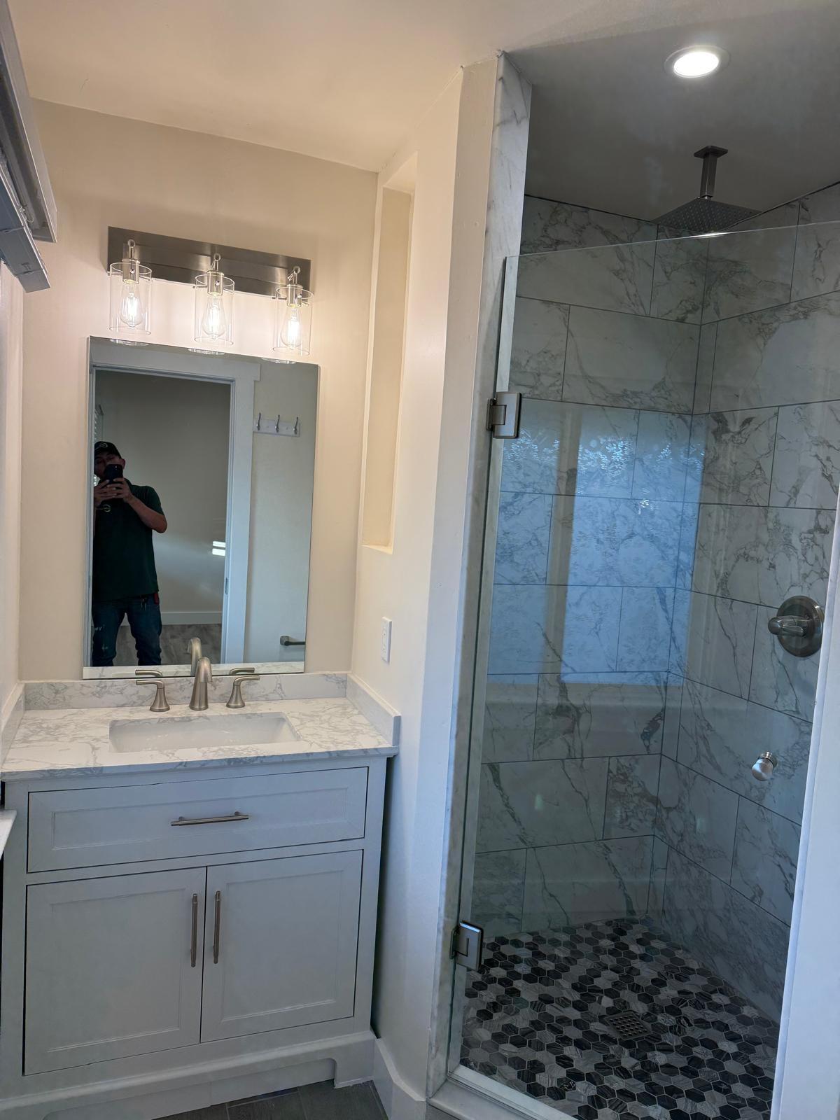 4946 8th Street, Unit B Carpinteria, CA 93013 - Photo 3 of 20 a bathroom with a sink shower and a mirror