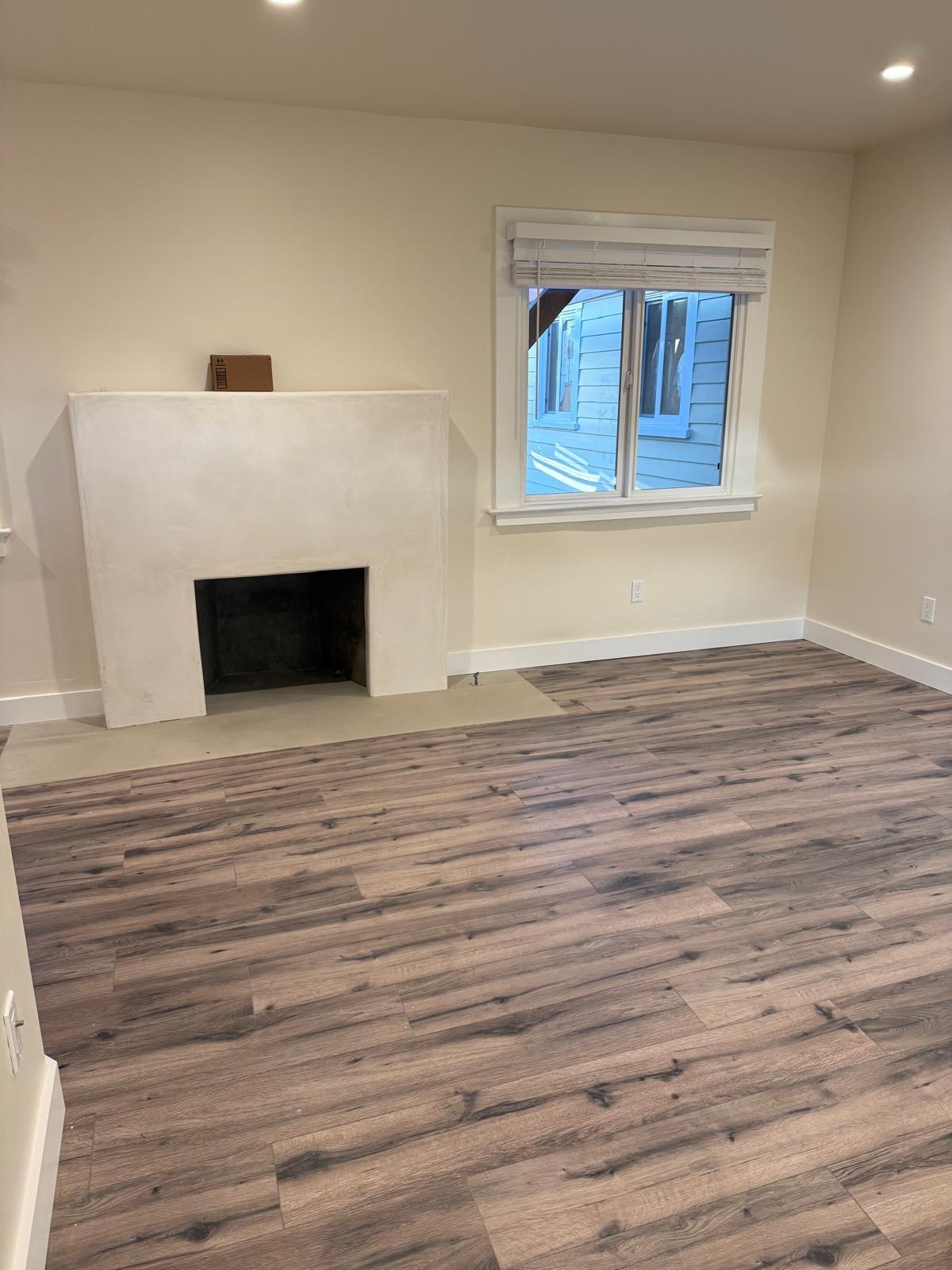 4946 8th Street, Unit B Carpinteria, CA 93013 - Photo 4 of 20 a view of empty room with wooden floor and fireplace