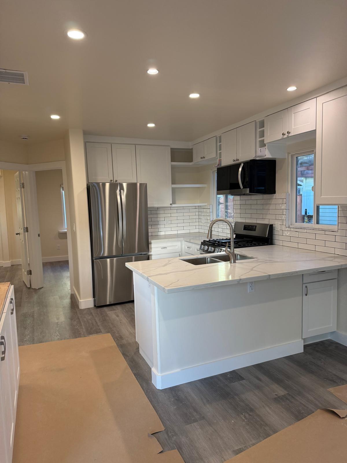 4946 8th Street, Unit B Carpinteria, CA 93013 - Photo 6 of 20 a kitchen with stainless steel appliances a refrigerator and a microwave