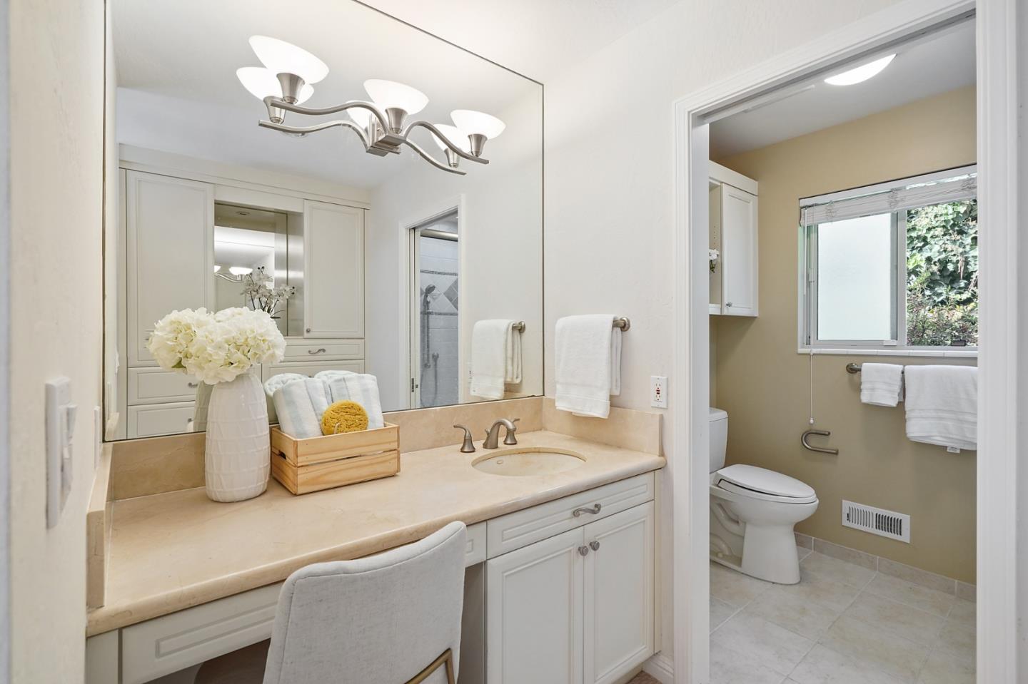 190 Pine Lane Los Altos, CA 94022 - Photo 15 of 26 a bathroom with a sink a toilet and a mirror