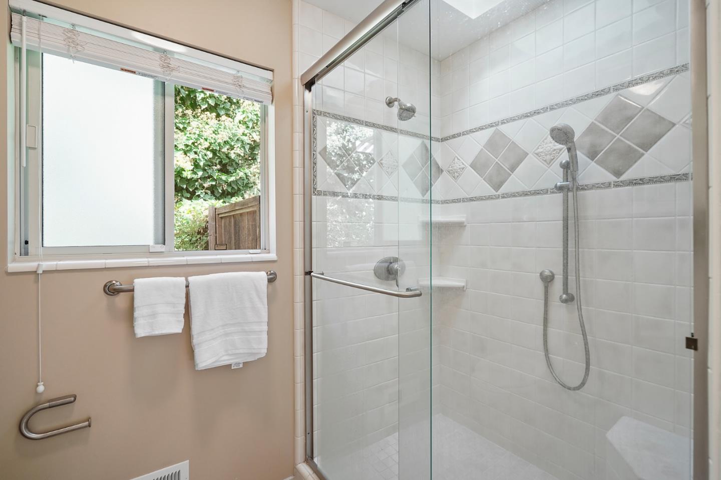 190 Pine Lane Los Altos, CA 94022 - Photo 16 of 26 a bathroom with a glass shower door