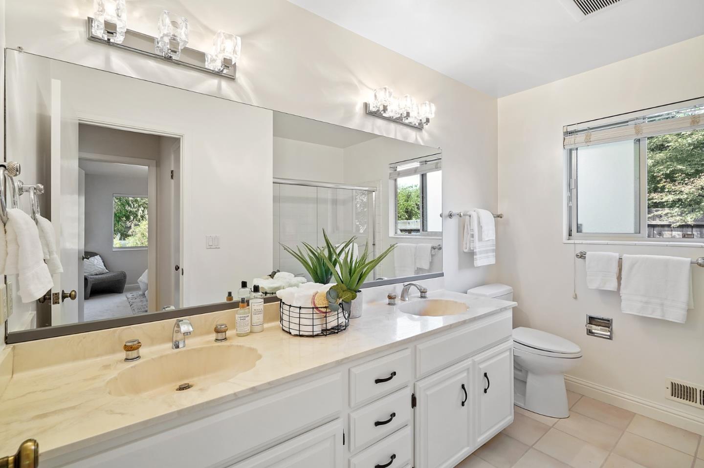 190 Pine Lane Los Altos, CA 94022 - Photo 19 of 26 a bathroom with a double vanity sink mirror and toilet