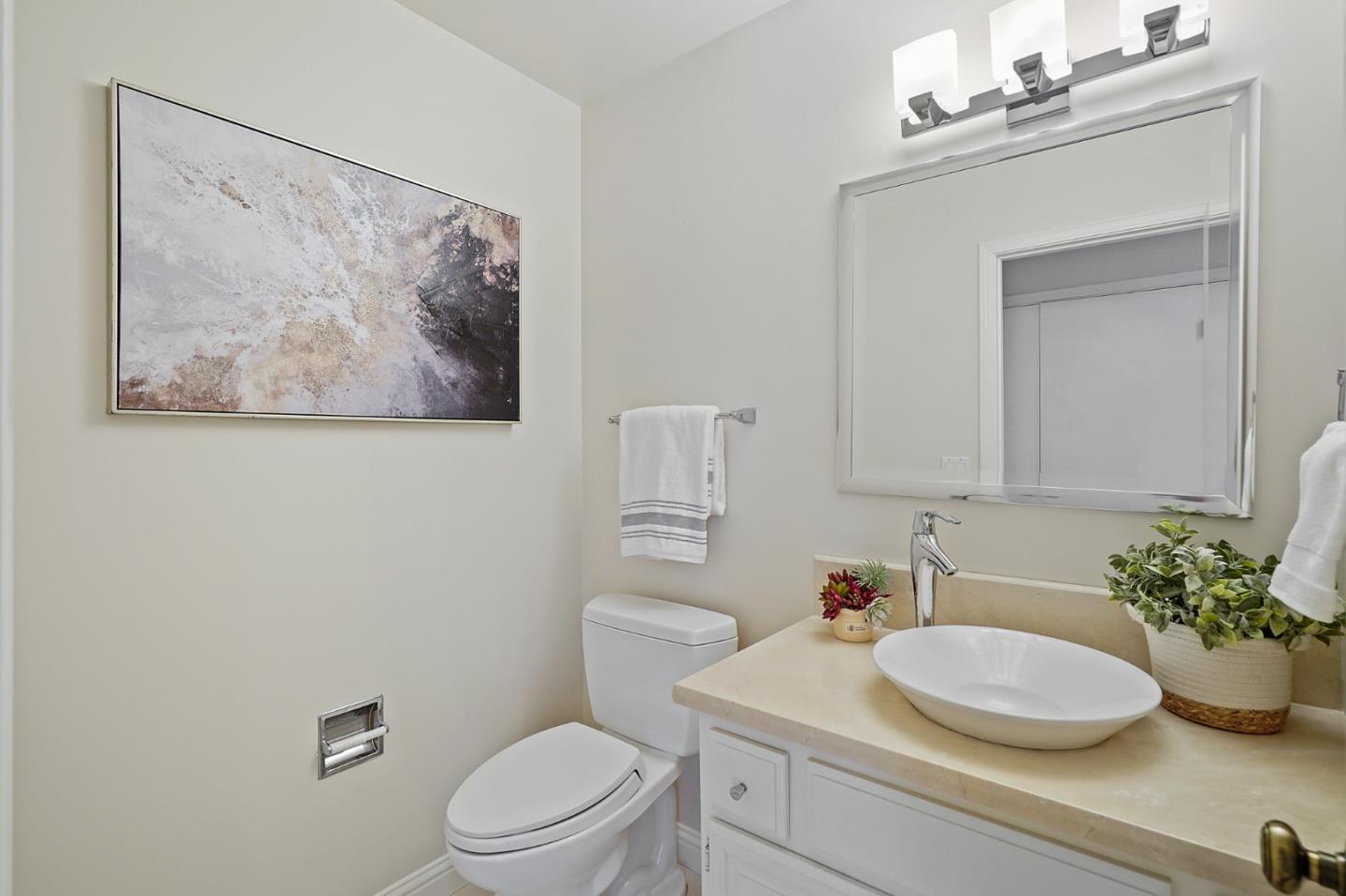 190 Pine Lane Los Altos, CA 94022 - Photo 21 of 26 a bathroom with a sink a toilet and a mirror