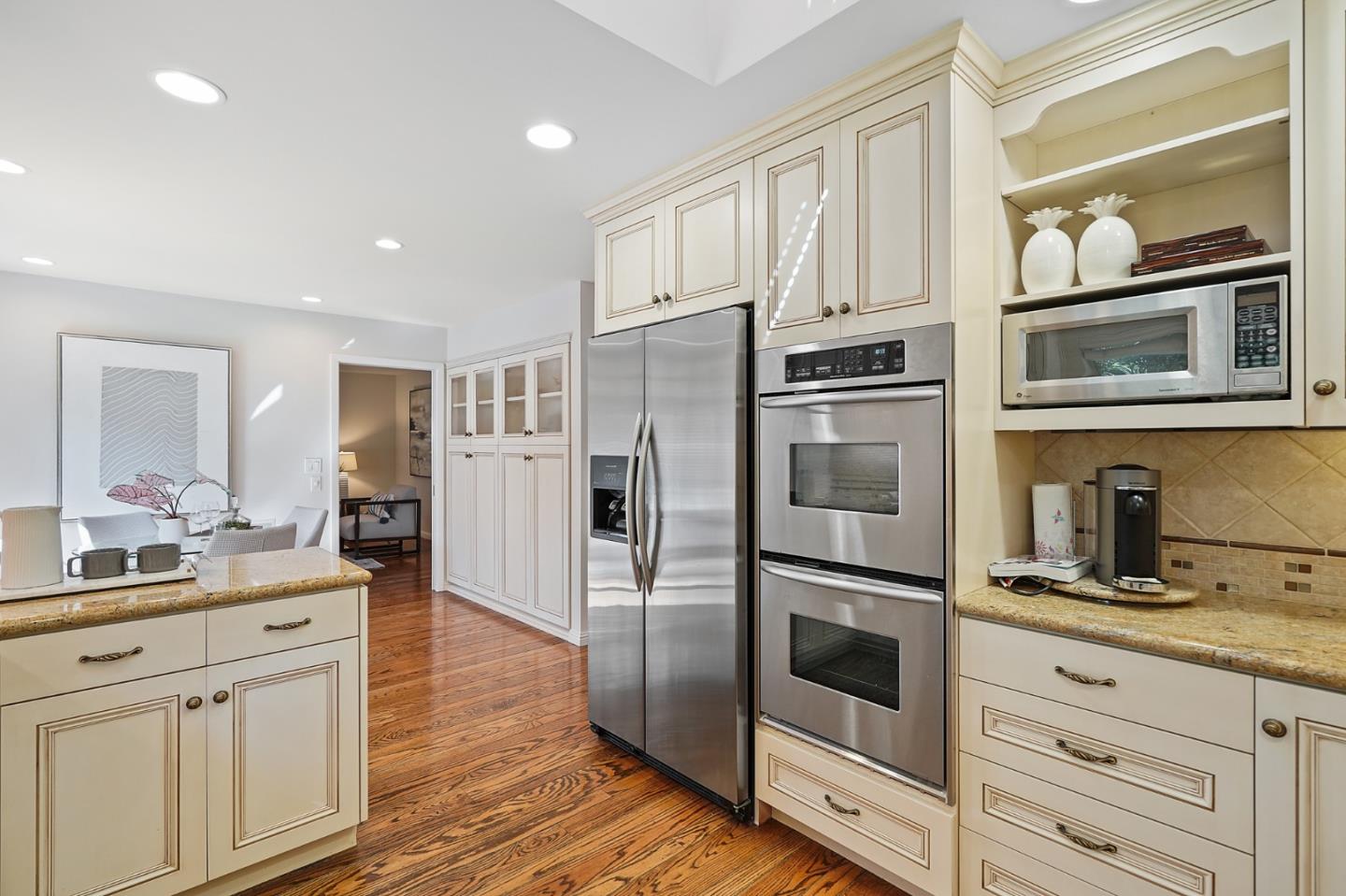 190 Pine Lane Los Altos, CA 94022 - Photo 9 of 26 a kitchen with stainless steel appliances a refrigerator stove and cabinets