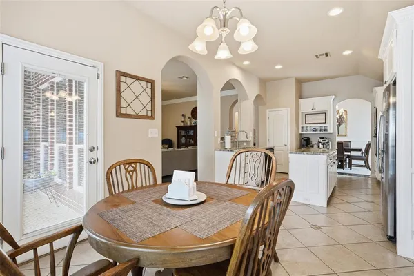 a view of a dining room and livingroom with furniture