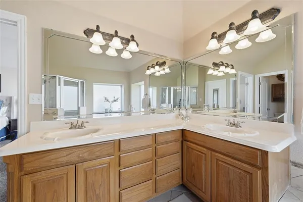 a bathroom with a sink vanity and a mirror