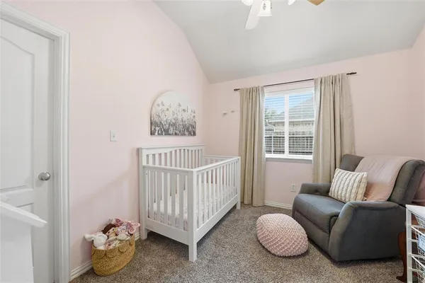 a bedroom with furniture and a window