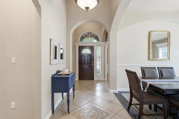a view of a dining room with furniture and a window