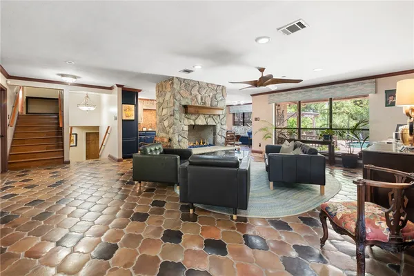 a living room with a couch and a fireplace