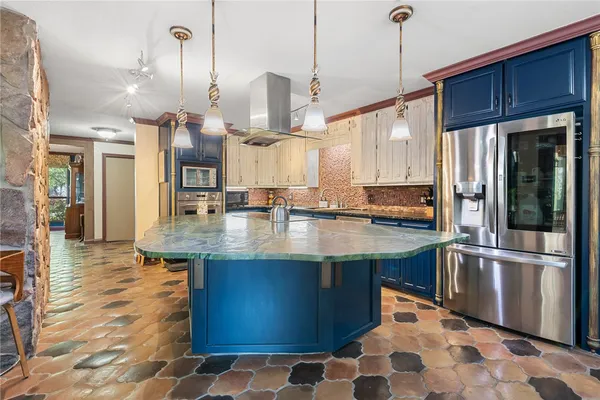 a view of a kitchen with a stove cabinets and a wooden floor