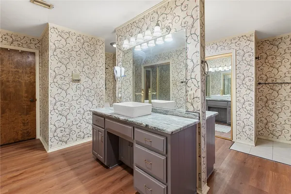 a kitchen with a sink and cabinets
