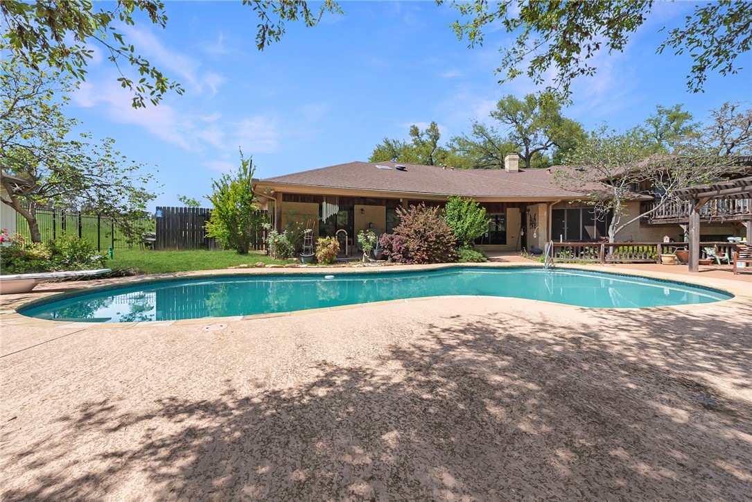 1309 Rock Dam Road Marlin, TX 76661 - Photo 34 of 50 Pool featuring a patio area, a diving board, and fence