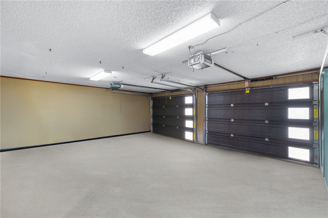1309 Rock Dam Road Marlin, TX 76661 - Photo 38 of 50 Garage with a garage door opener