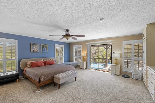 an aerial view of a house with a yard swimming pool outdoor seating and yard