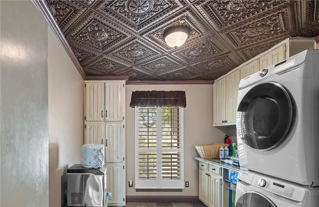 an aerial view of a house with a garden and trees