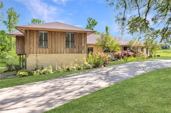 a front view of a house with garden