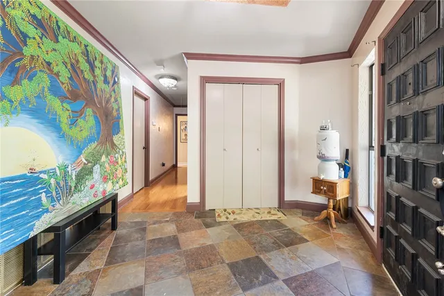 a spacious bedroom with a bed and a large window