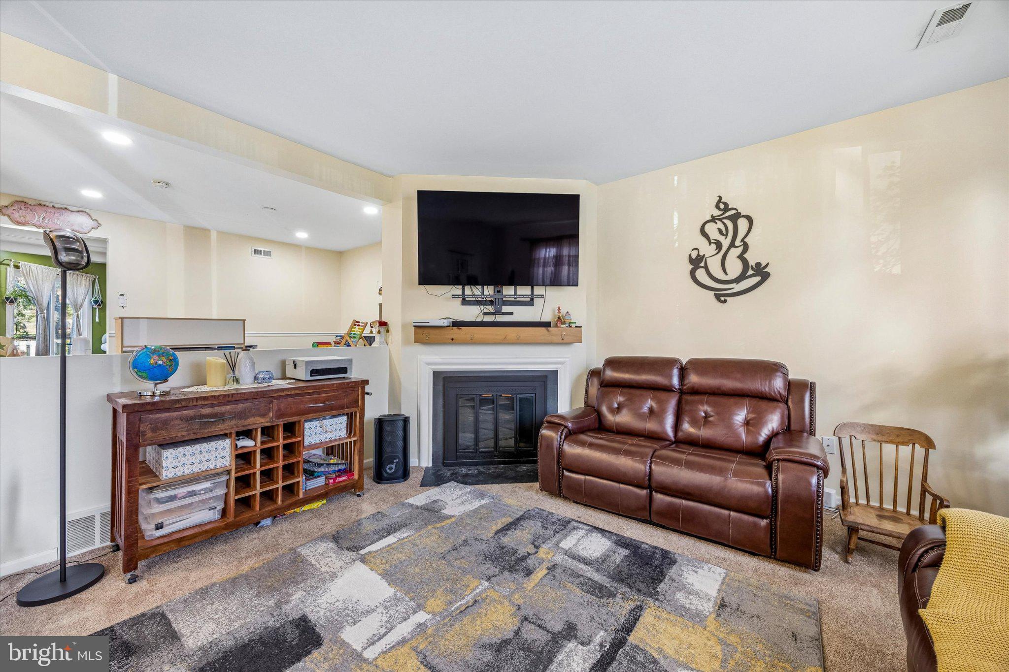 24 Independence Place Newtown, PA 18940 - Photo 3 of 15 a living room with furniture and a flat screen tv