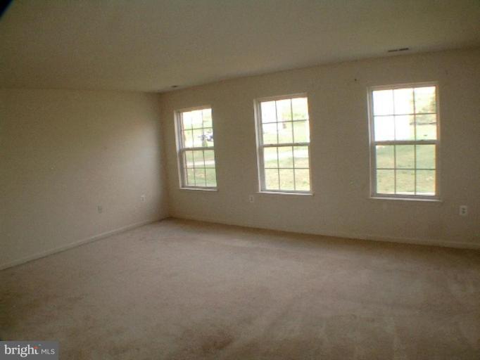 8 Marblehead Road Inwood, WV 25428 - Photo 11 of 18 an empty room with windows