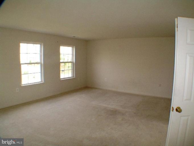 8 Marblehead Road Inwood, WV 25428 - Photo 12 of 18 an empty room with windows