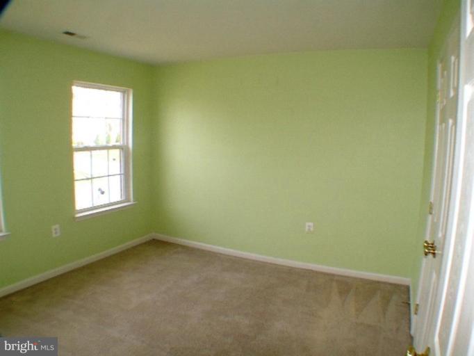 8 Marblehead Road Inwood, WV 25428 - Photo 17 of 18 a view of an empty room with a window