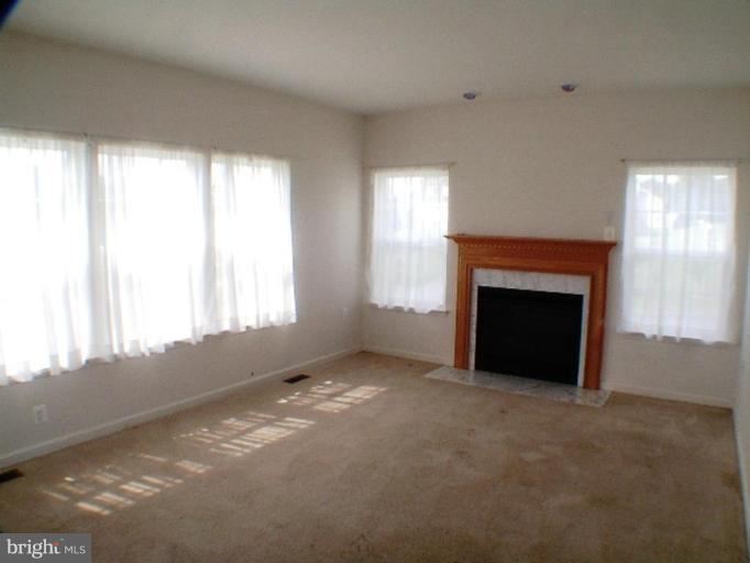8 Marblehead Road Inwood, WV 25428 - Photo 5 of 18 a view of empty room with a fireplace