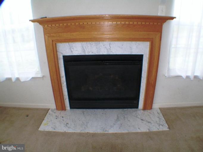 8 Marblehead Road Inwood, WV 25428 - Photo 6 of 18 a living room with a fireplace