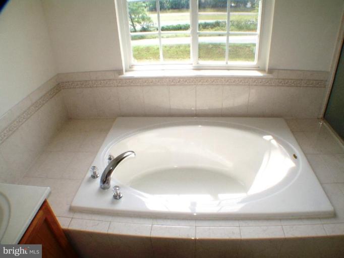 8 Marblehead Road Inwood, WV 25428 - Photo 7 of 18 a bathroom with a sink