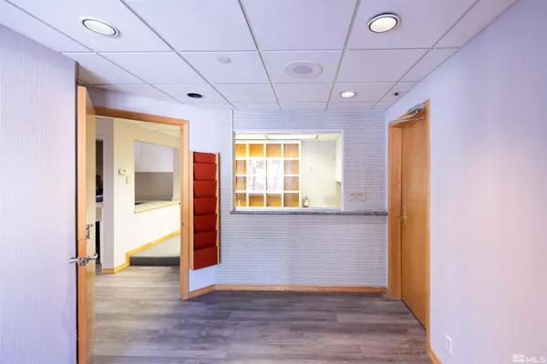 a view of entryway with wooden floor