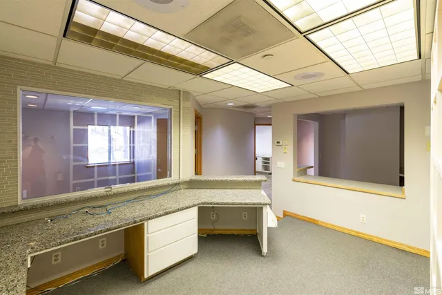 a bathroom with a sink and a large mirror